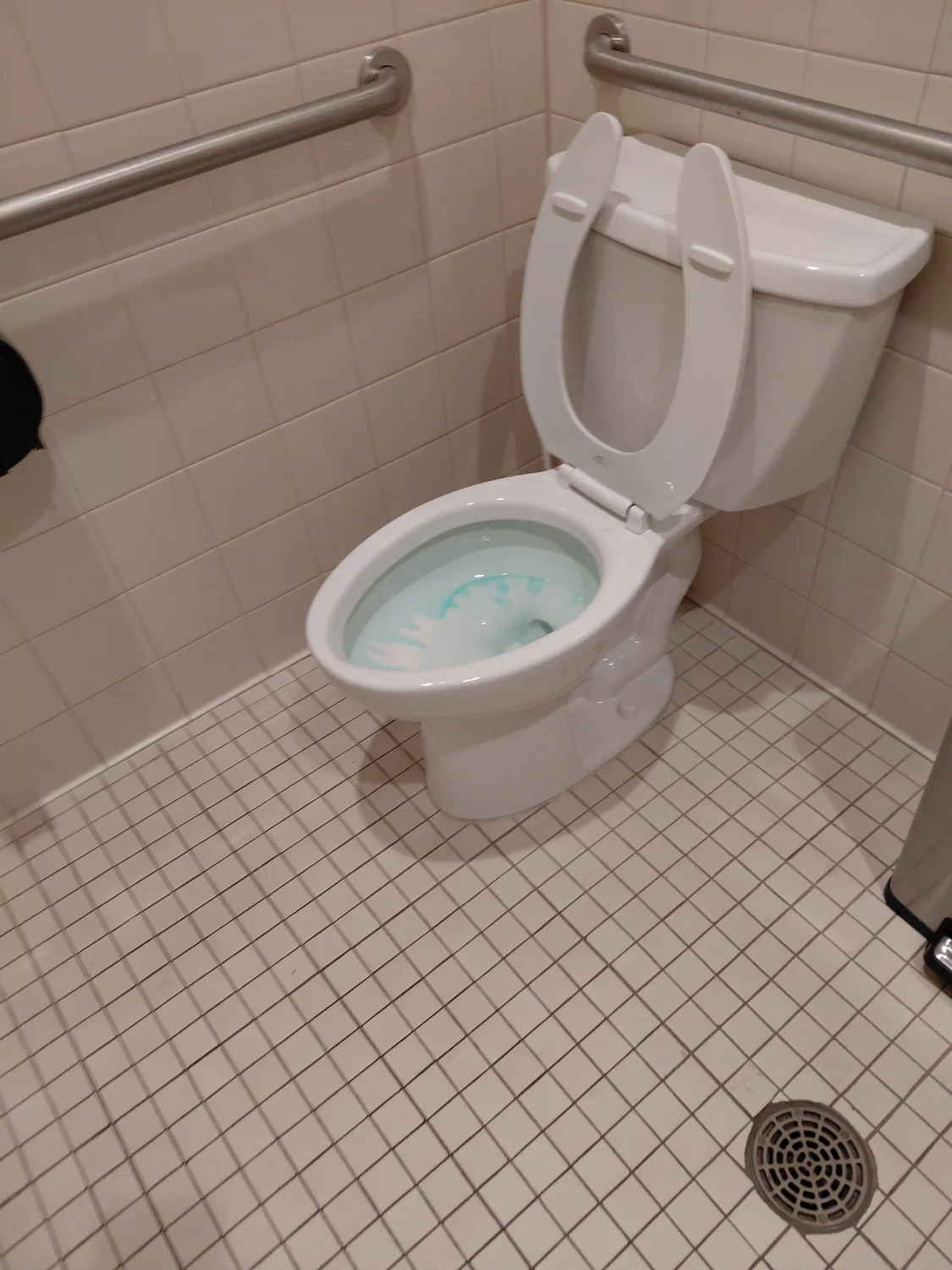 Commercial restroom cleaned and sanitized by Aquamen Cleaning